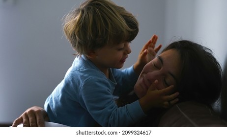 Little Boy Biting Mother Nose, Real Life Authentic Family Moment At Home