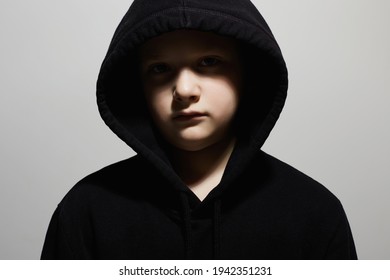 Little Boy In Black Hoodie. Close-up Portrait Of Teenager Boy. Child