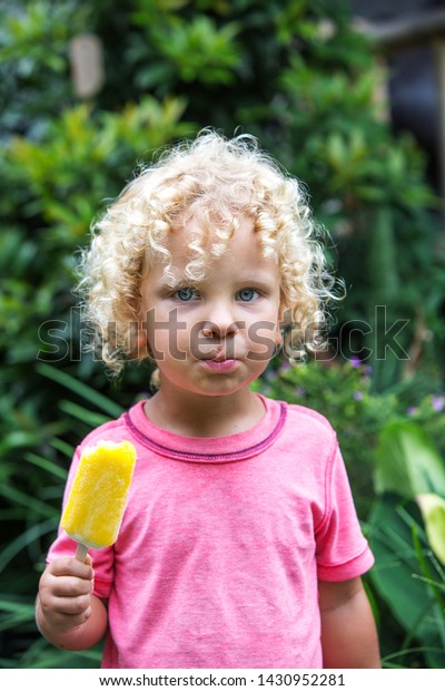 Little Boy Blonde Curly Hair Eating Stock Photo Edit Now 1430952281