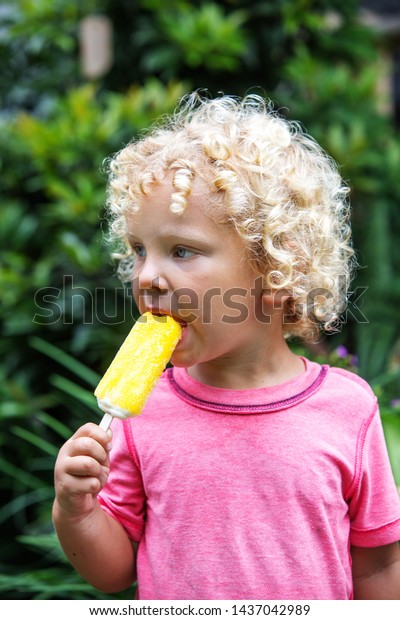 Little Boy Blonde Curly Hair Eating Stock Photo Edit Now 1437042989