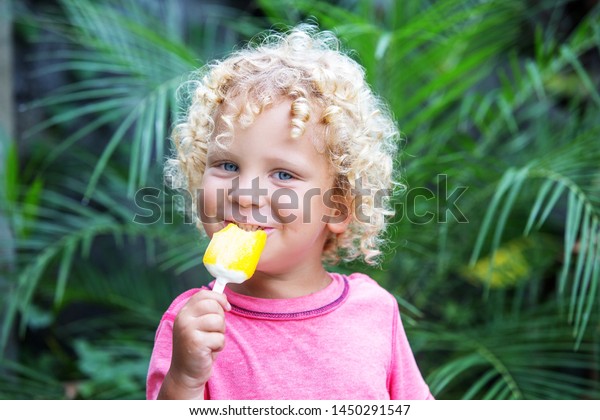 Little Boy Blonde Curly Hair Eating Stock Photo Edit Now 1450291547