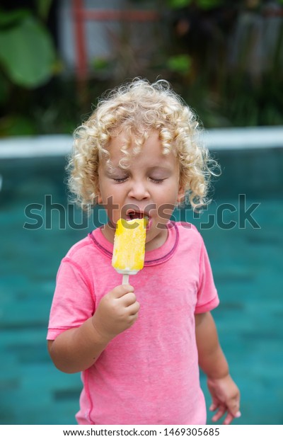 Little Boy Blonde Curly Hair Eating Stock Photo Edit Now 1469305685