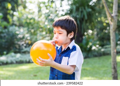 Little Boy Blowing Orange Balloon Park Stock Photo 239582422 | Shutterstock