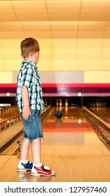 little boy at the bowling alley