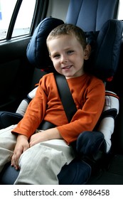 little boy in car safety seat