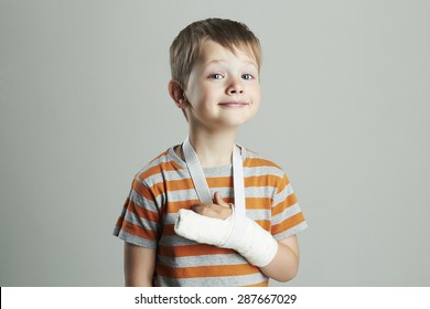 Little Boy In A Cast.child With A Broken Arm. Funny Kid After Accident.