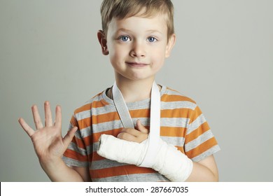 Little Boy In A Cast.child With A Broken Arm. Funny Kid After Accident.