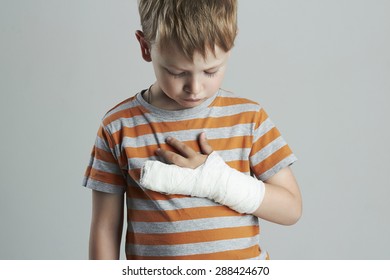 Little Boy In A Cast.child With A Broken Arm.kid After Accident