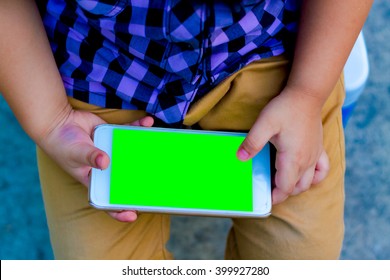 Little Boy Child Kid Playing Games On Smartphone Mobile Phone