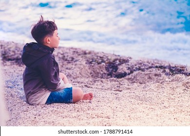 Little Boy Child Meditating On The Beach Mindful Breathing