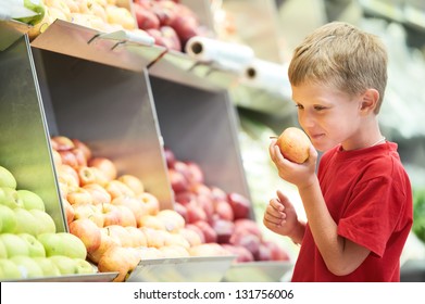 Little Boy Choosing Bio Apple Food In Fruit Vegetable Shopping Store