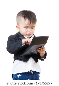 Little boy concentrating on using calculator