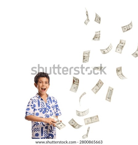 Little boy counting a stack of dollar bills and looking excited isolated on white background