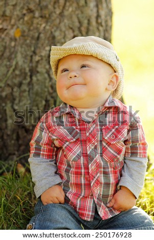 Similar – small girl wearing a hat singing happily