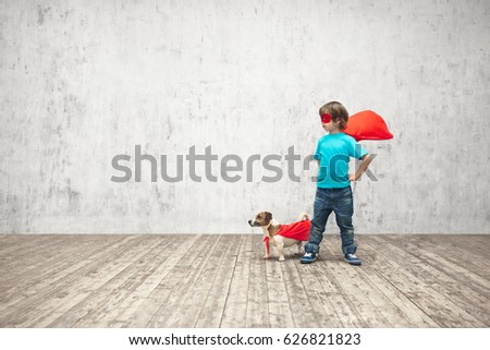 Little boy with dog in studio