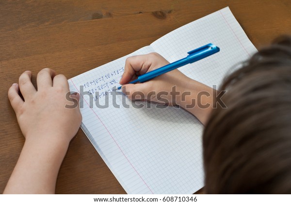 kid doing math homework he broke