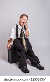 Little boy dressed as businessman