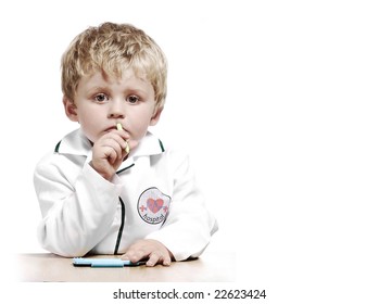 Little Boy Dressed As A Doctor With A Serious Expression