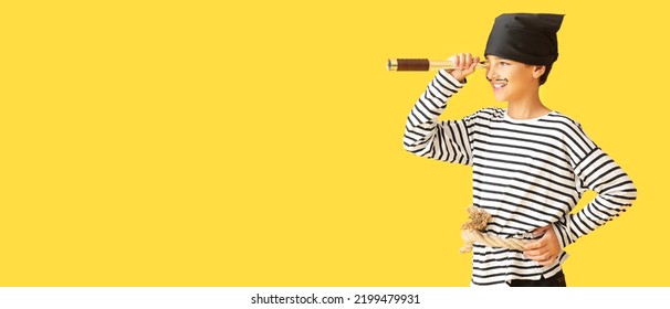 Little Boy Dressed As Pirate With Spyglass On Yellow Background With Space For Text