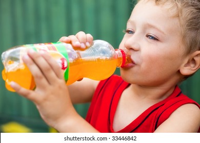 Little Boy Drinking Unhealthy Bottled Soda