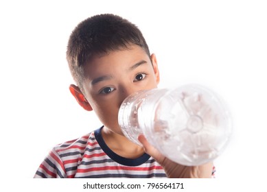 Little Boy Drinking Water From The Bottle