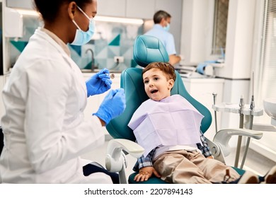 Little Boy During Teeth Check Up At Dentist's Office.