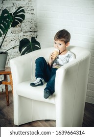 Little Boy Eating Ice Cream At Home