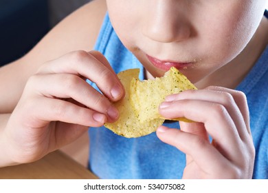 Little Boy Eating Potato Chips Closeup