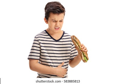 Little Boy Eating A Sandwich And Experiencing Stomach Pain Isolated On White Background