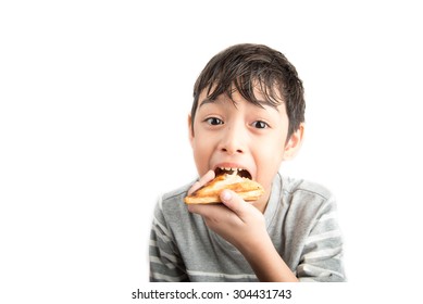 Little Boy Eating Sandwich On White Background