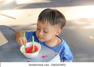 Little Boy Eating Shaved Ice.