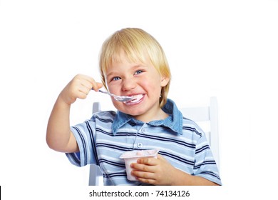 Little Boy Eating Yogurt Isolated On White Background