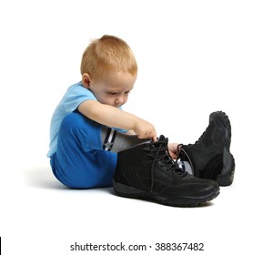 Little Boy In Father's Shoes