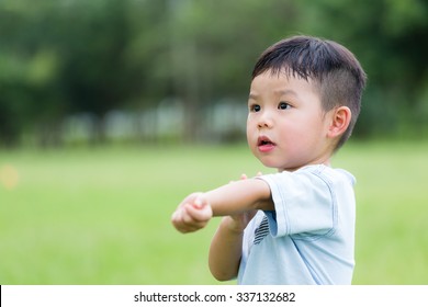 Little Boy Feeling Itchy And Scratching On Him Arm