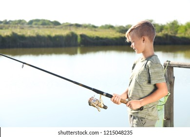 Little Boy Fishing Alone On Sunny Day