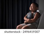 A little boy, full of faith, sits with the holy Bible in his hands, praying to God and embracing his Christian religion. child, person, bible, boy, religion, christian, holy, little, faith, god.