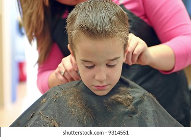 Little Boy Getting A Hair Cut