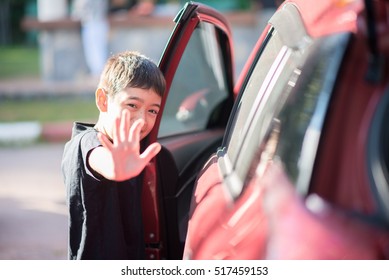 Little Boy Getting Into The Car