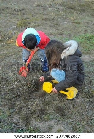 Similar – Image, Stock Photo Little girl putting apple inside of wicker basket