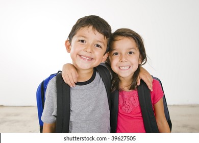 Little boy and girl with their book bags