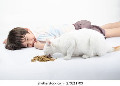 Little Boy Giving Food For Cat