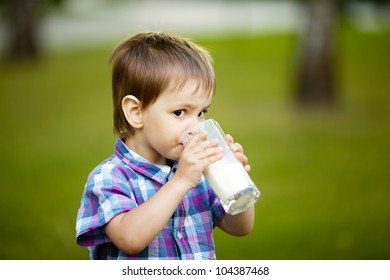 little boy with glass of milk