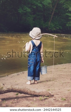 Little boy going fishing at the river