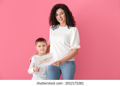 Little Boy Greeting His Mom On Mother's Day Against Color Background