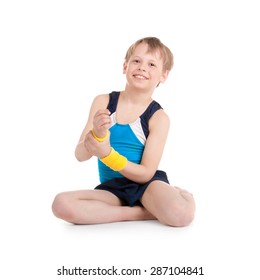 Little Boy Gymnast Doing Exercises