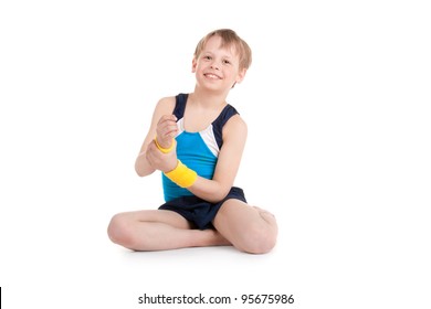 Little Boy Gymnast Doing Exercises