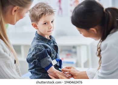 Little Boy Having Blood Sample Drawn In A Lab