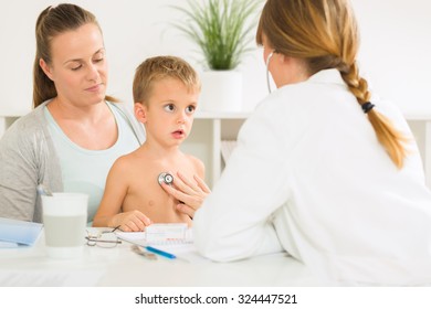 Little Boy Having A Medical Exam With A Stethoscope.