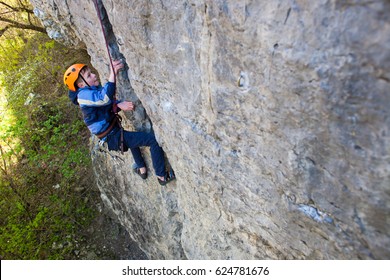 The Little Boy In The Helmet Climbs The Rock, Kid Rock Climber Sports Outdoors.