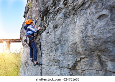 The Little Boy In The Helmet Climbs The Rock, Kid Rock Climber Sports Outdoors.